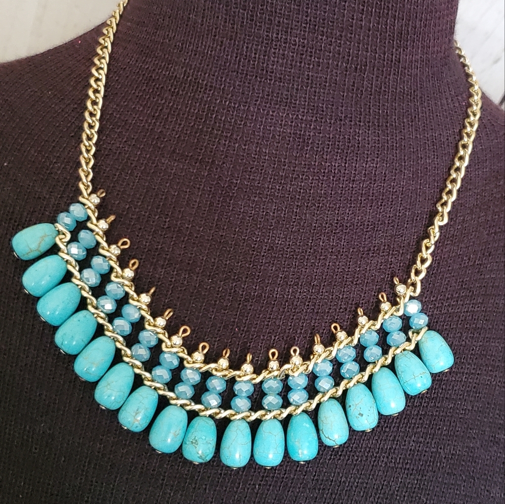 Goldtone bib necklace with blue iridescent beads and faux turquoise drops